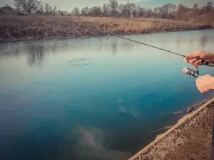 Picture of someone fishing on the lake