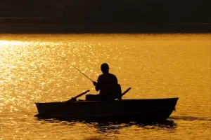 Picture of a man fishing from a boat