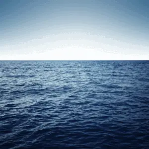 A blue ocean with waves.
