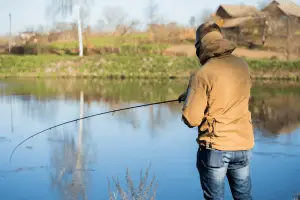 Man fishing by a lake