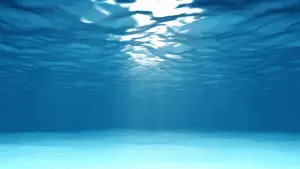 Light shining underwater in the ocean