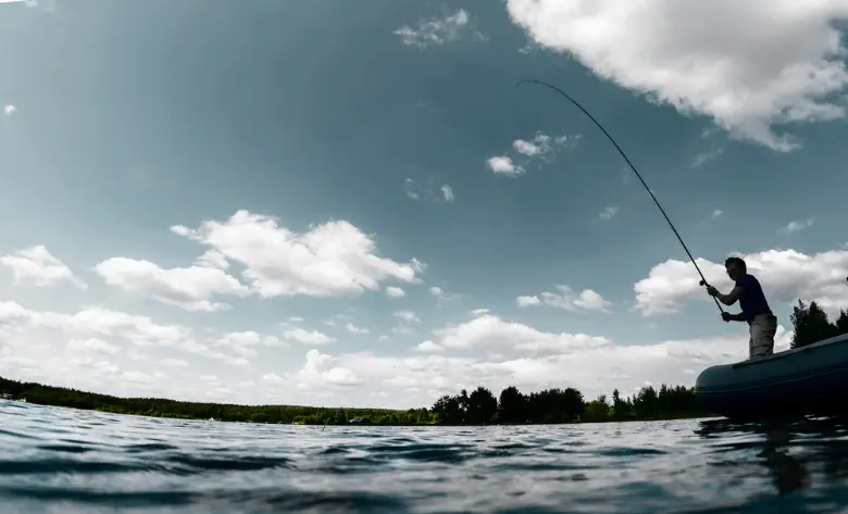 Man fishing with a spinning reel