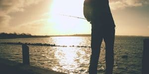 Fisherman casting on a river