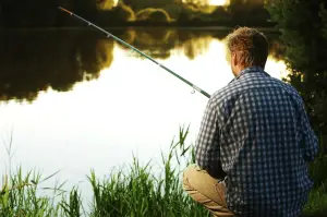 angler fishing from the river bank