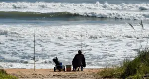 angler fishing from the beach