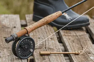 close up of a lightweight fishing rood with wooden handle