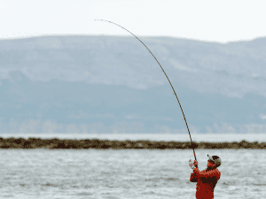 angler fishing on a cloudy day