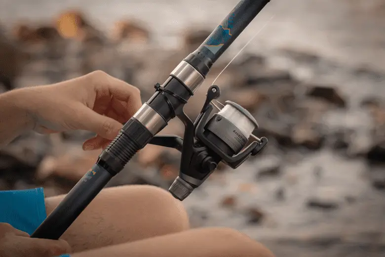 close-up of angler holding a fishing reel
