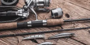 close up shot of fishing rods on a wooden surface