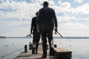 two anglers walking on the dock for fishing