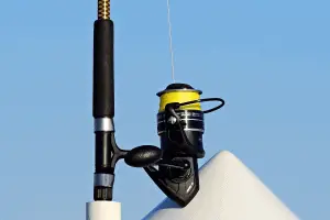 close up of fishing rod placed on boat